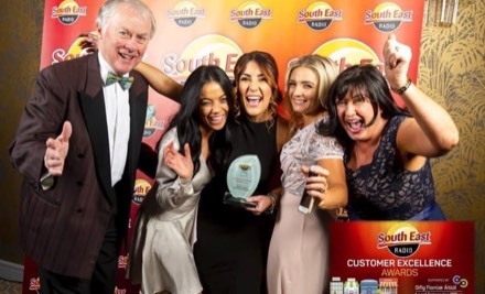 The Saints team celebrating with their trophy at the South East Radio Customer Excellence Awards.