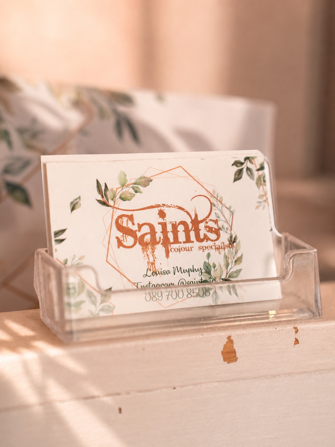 Saints business cards on the desk.