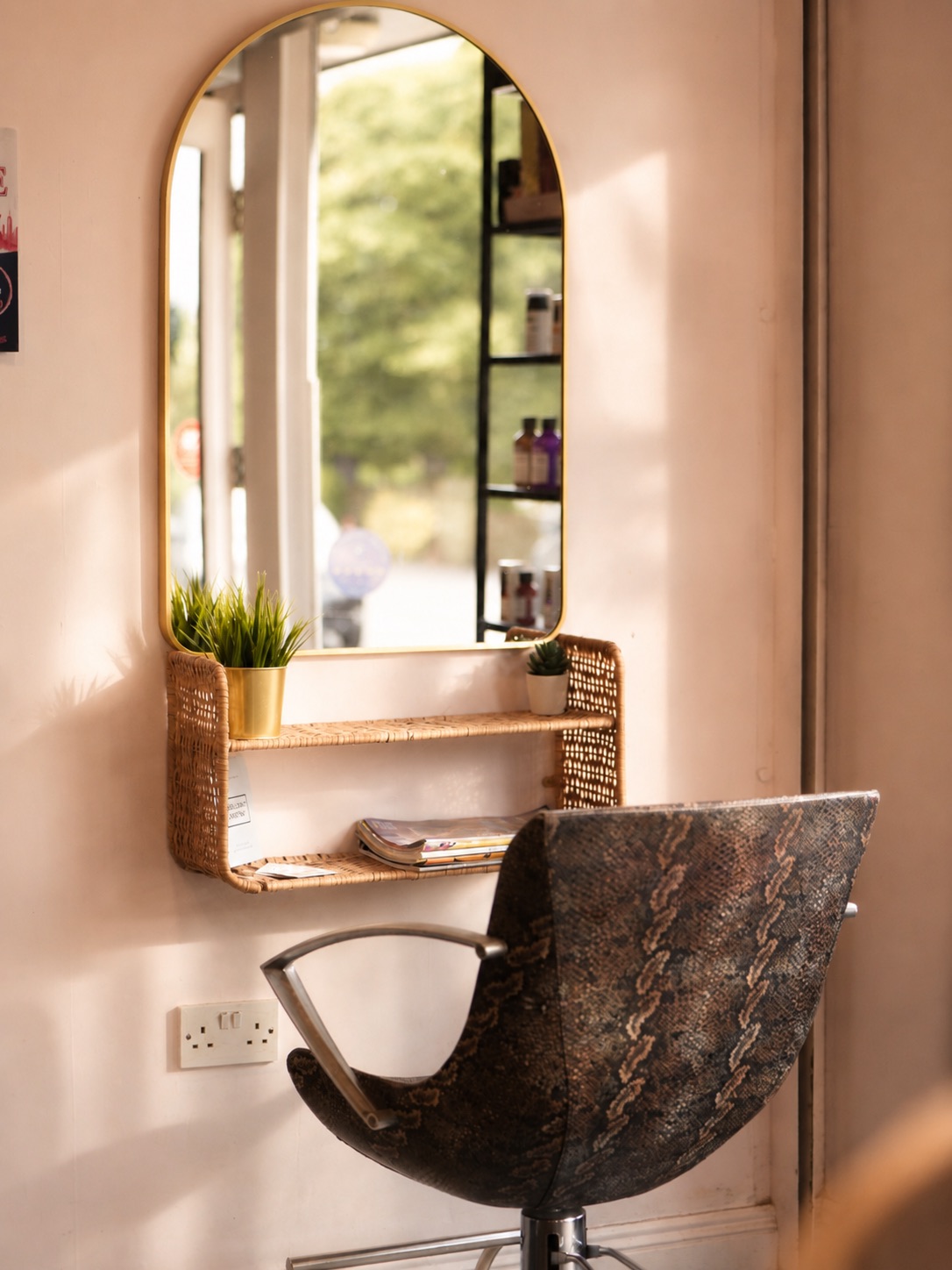 A styling station with an arched mirror.