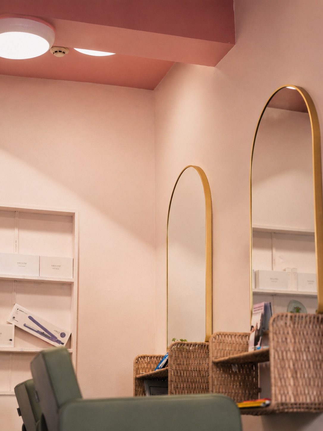 Mirrors and woven baskets along the wall of the salon.